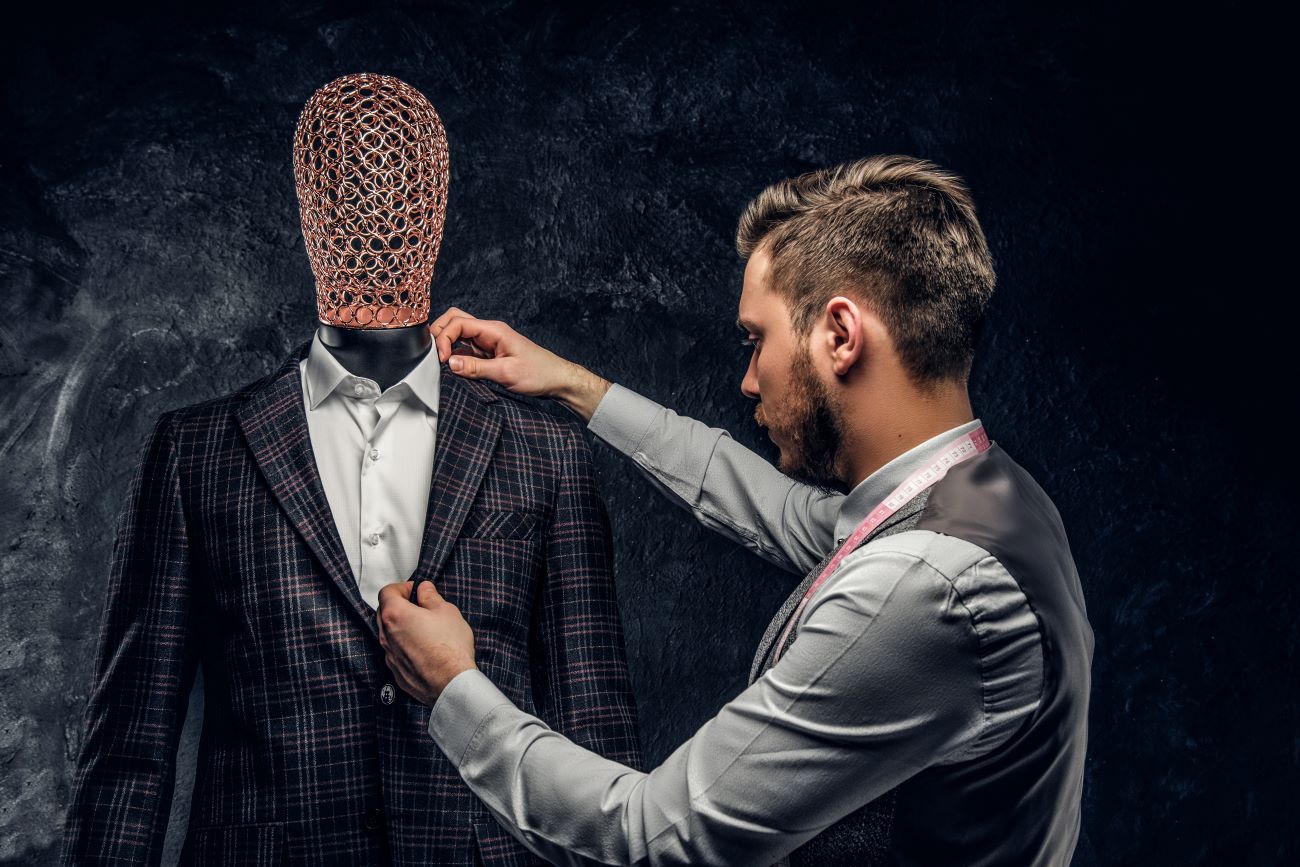 young-fashion-designer-next-to-a-mannequin-in-excl-3AVSB9Z